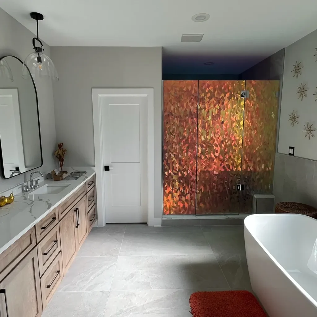 Bathroom with iridescent decorative film on the shower glass and frosted film on the window in St. John, IN