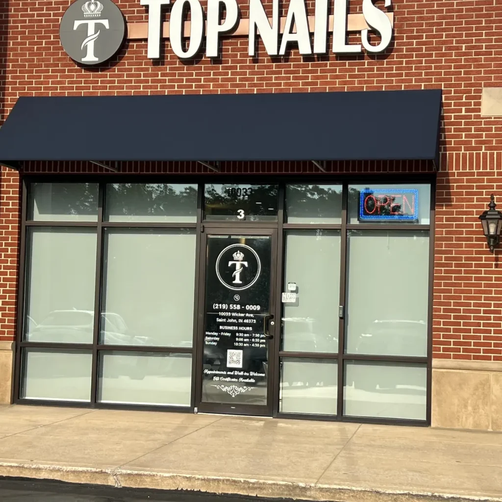 Brick commercial storefront with window film on the front windows in St. John, IN