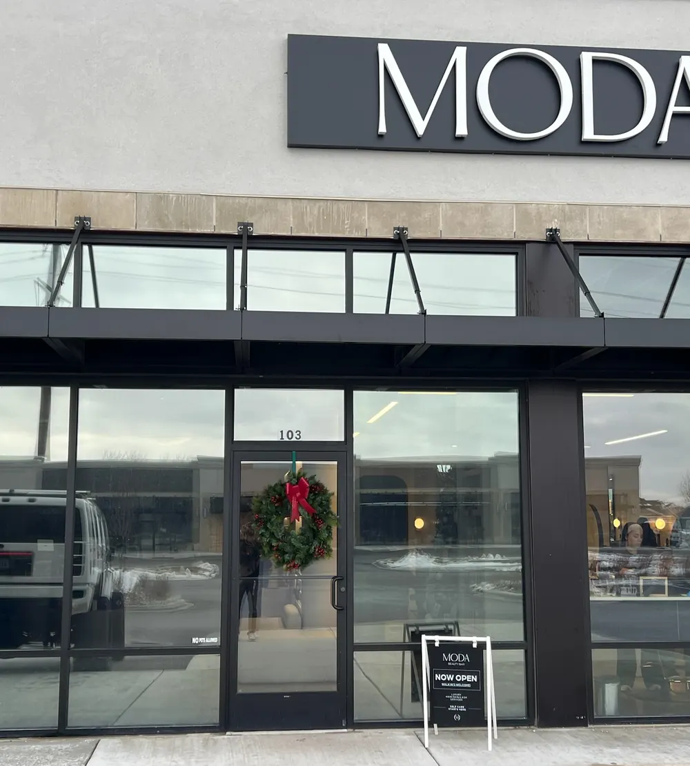 Commercial window tinting on a retail storefront glass front in St. John, IN
