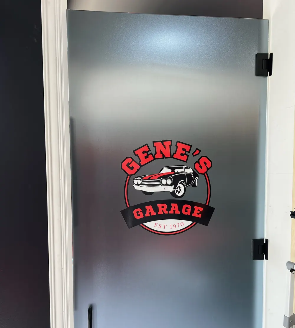 Frosted glass door with a custom logo graphic, vinyl graphics and logo film in St. John, IN