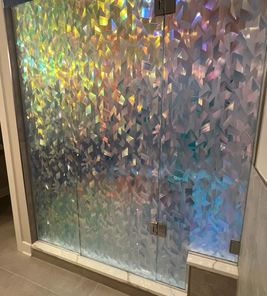 Iridescent decorative film applied to a glass shower enclosure in St. John, IN