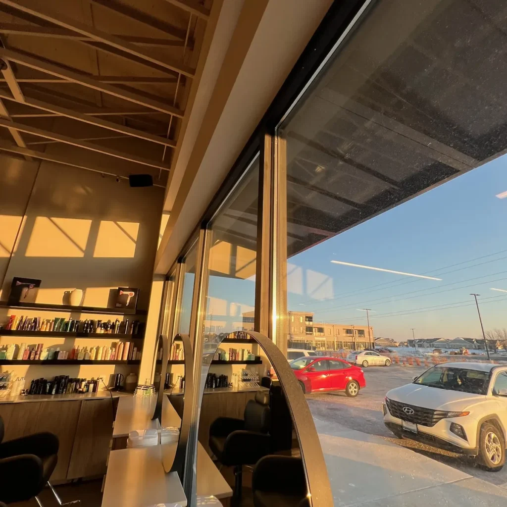 Interior view of tinted commercial windows in a salon in St. John, IN