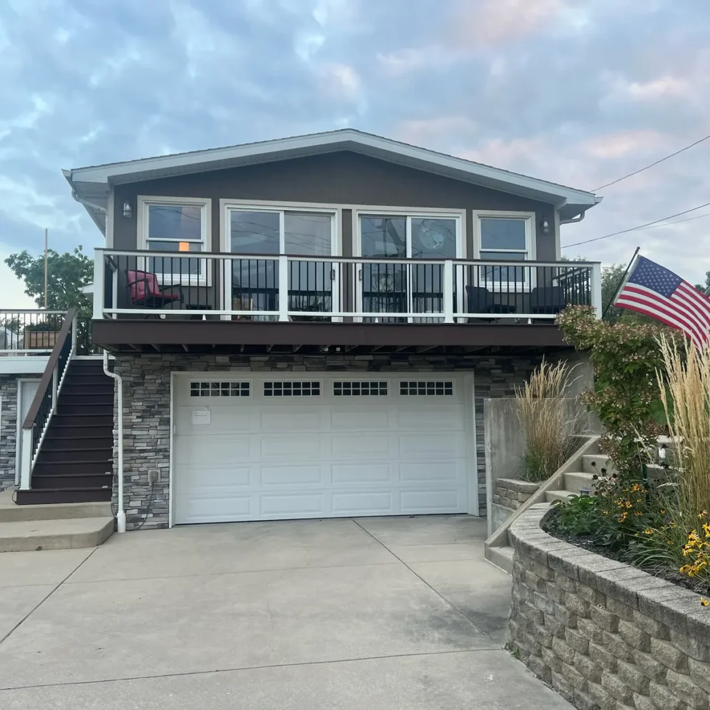 Two-story home with a balcony and garage, residential window tinting project in Cedar Lake, IN