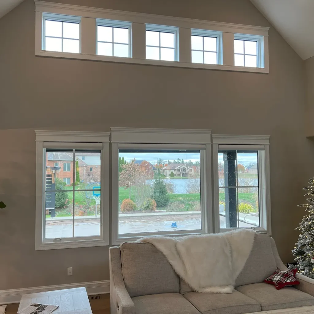 Vaulted living room with transom and picture windows after residential window tinting in St. John, IN